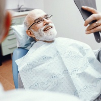 Man smiling at the dentist with dental implants in Houston