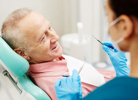 Man smiling and preparing for dentures in Houston