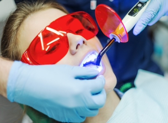 Woman receiving cosmetic dental bonding treatment