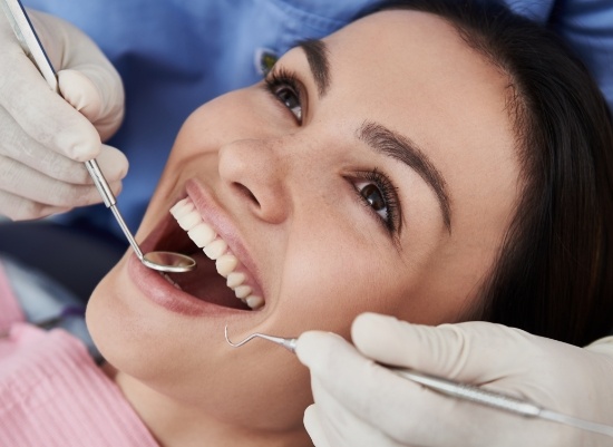 Patient receiving a thorough dental evaluation