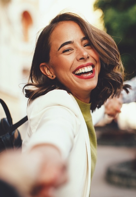 Woman with gorgeous smile after cosmetic dentistry