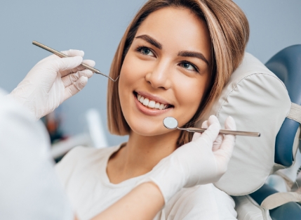 Smiling woman in dental chair