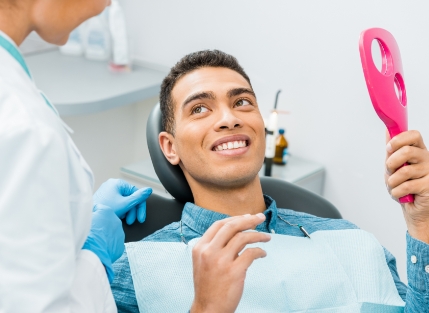 Smiling man in dental chair