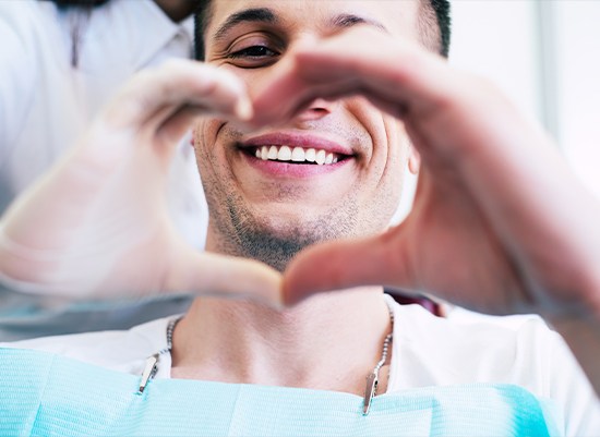 Man smiling after tooth extraction