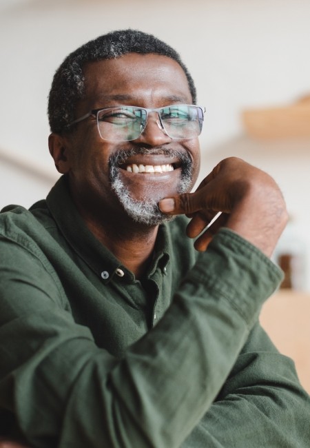 Man smiling after endodontic retreatment