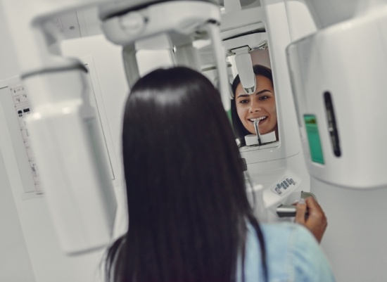 Patient receiving 3 D C T cone beam x-ray scans