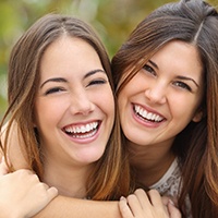 women smiling and laughing together