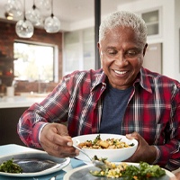 Man eating meal with loved ones