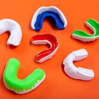 Colored mouthguards essential to dental implant care in in Houston
