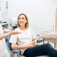 Woman at dental checkup with implant dentist in Houston