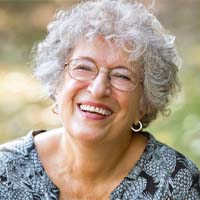 Woman smiling with dental implants in Houston