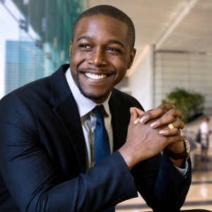 Man in suit sitting at desk