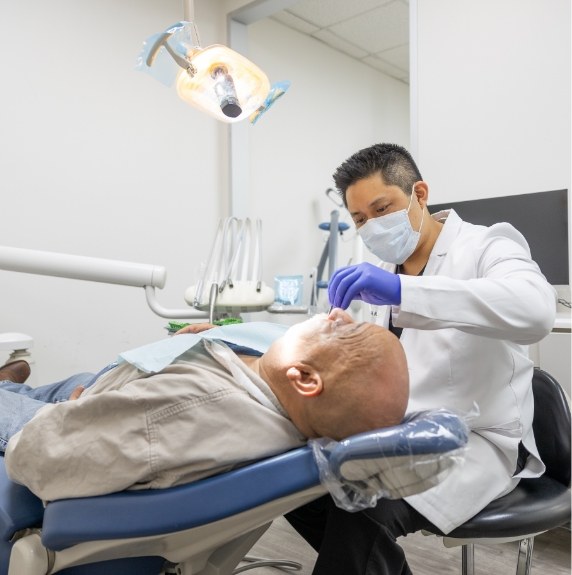 team member reviewing patient smile on computer