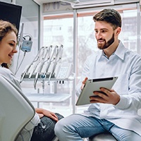 A dentist talking with his patient about oral conscious sedation