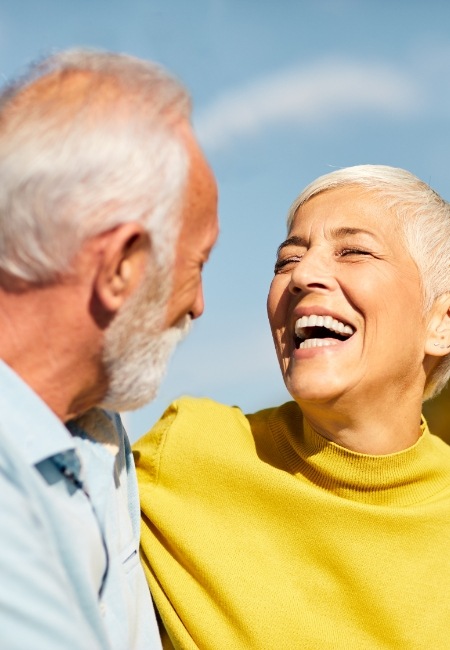 Woman sharing healthy smile after pocket reduction surgery