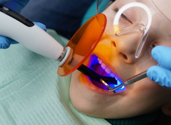 Child receiving dental sealants