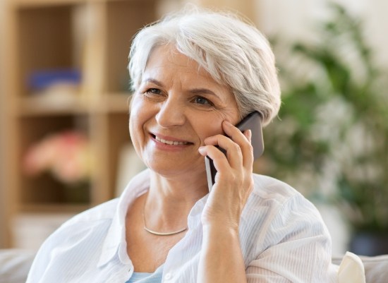 Woman calling to schedule a periodontal therapy appointment