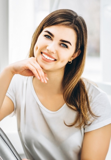 Woman smiling after sedation dentistry visit