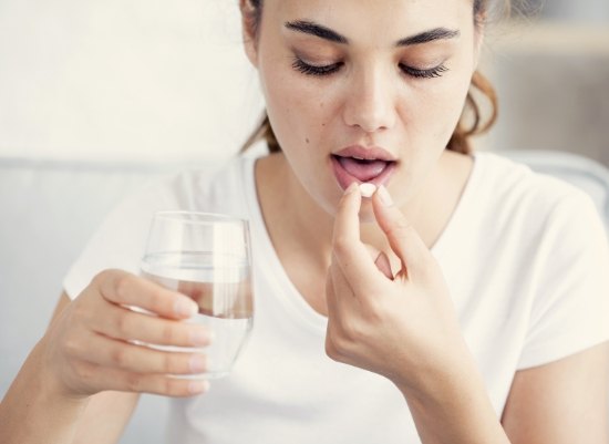 Patient taking oral conscious dental sedation pill