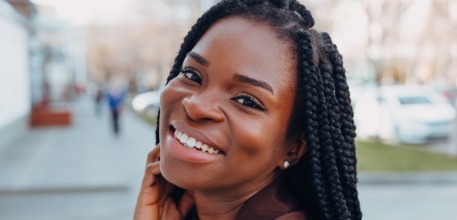 Woman with flawless smile thanks to cosmetic dentistry