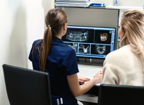 Dental team members reviewing digital x-rays