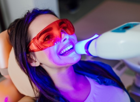 Patient receiving Zoom in office teeth whitening treatment