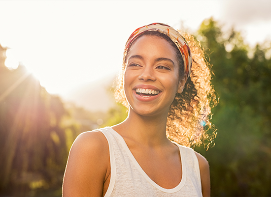 Woman smiling after wisdom tooth extraction