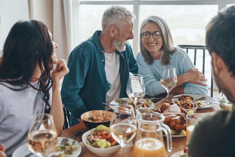 A family enjoying Thanksgiving with healthy foods that stimulate saliva production