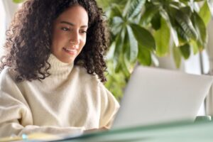 Woman using her computer to look for information