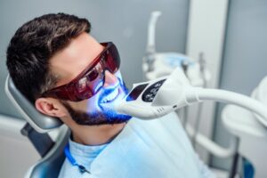 Patient having teeth whitened.