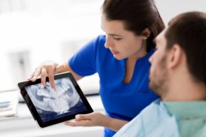 dentist discussing patient’s X-rays